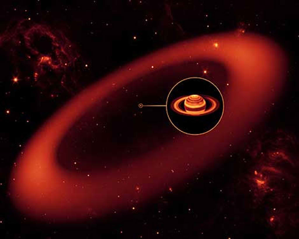 Ilustraci�n de la vista infrarroja del nuevo anillo de Saturno. El telescopio Spitzer de la NASA ha descubierto un anillo gigante, compuesto de part�culas de polvo y hielo alrededor de Saturno. En su parte m�s cercana se encuentra a 6 millones de kil�metros del planeta y se extiende hasta una distancia de unos 12 millones.